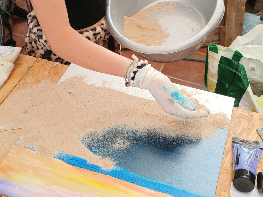 Handmade artwork featuring real sand, shells, and pebbles from Bolonia Beach by Sun Kissed Crafts.